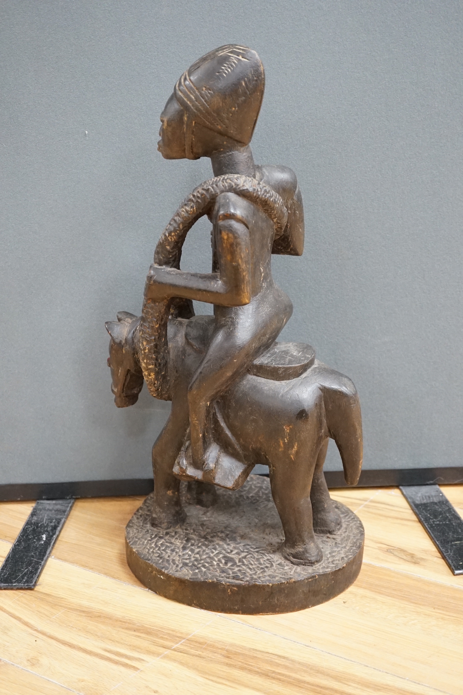 A West African tribal figure of a warrior on horseback, probably Dogon, 57cm high